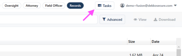 Tasks button in the top navigation bar, highlighted with a pink arrow, used to open the upload progress manager.
