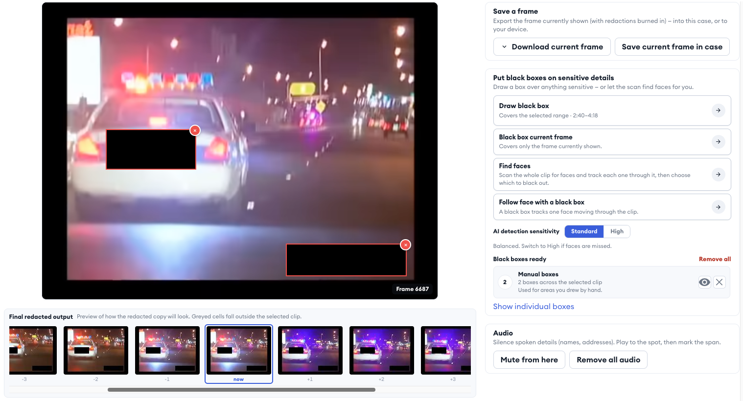 Video redaction screen showing a police car's lights in a night scene, with two manual black boxes placed over a plate and a corner area, and the Manual boxes panel listing 2 boxes.
