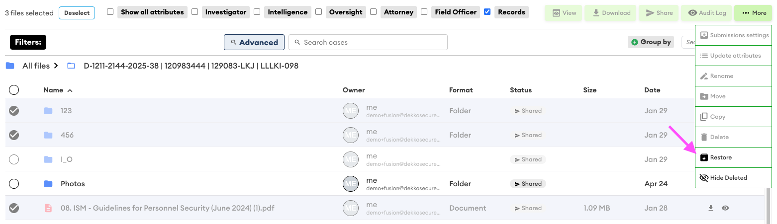File list with three items selected; the More menu is open showing Restore highlighted with a pink arrow pointing to it.