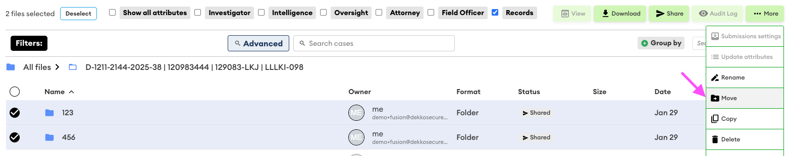 Two folders selected in a case file list, with the More dropdown open showing the Move option highlighted by a pink arrow.