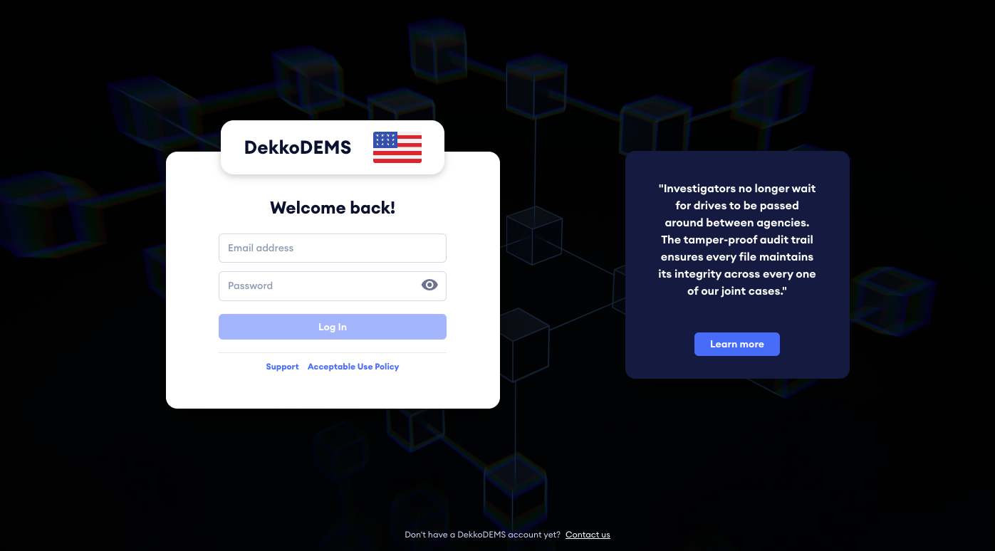 Login page for DekkoDEMS showing the "Welcome back!" form with Email address and Password fields, a Log In button, Support and Acceptable Use Policy links, and a US flag.